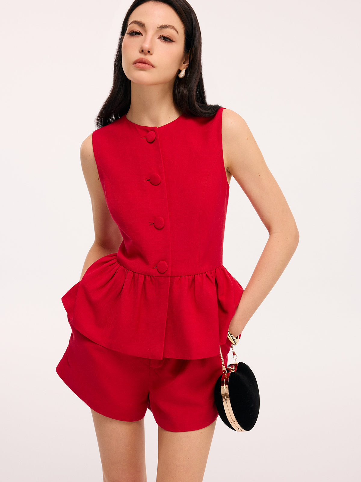 Conjunto de top peplum sin mangas y shorts